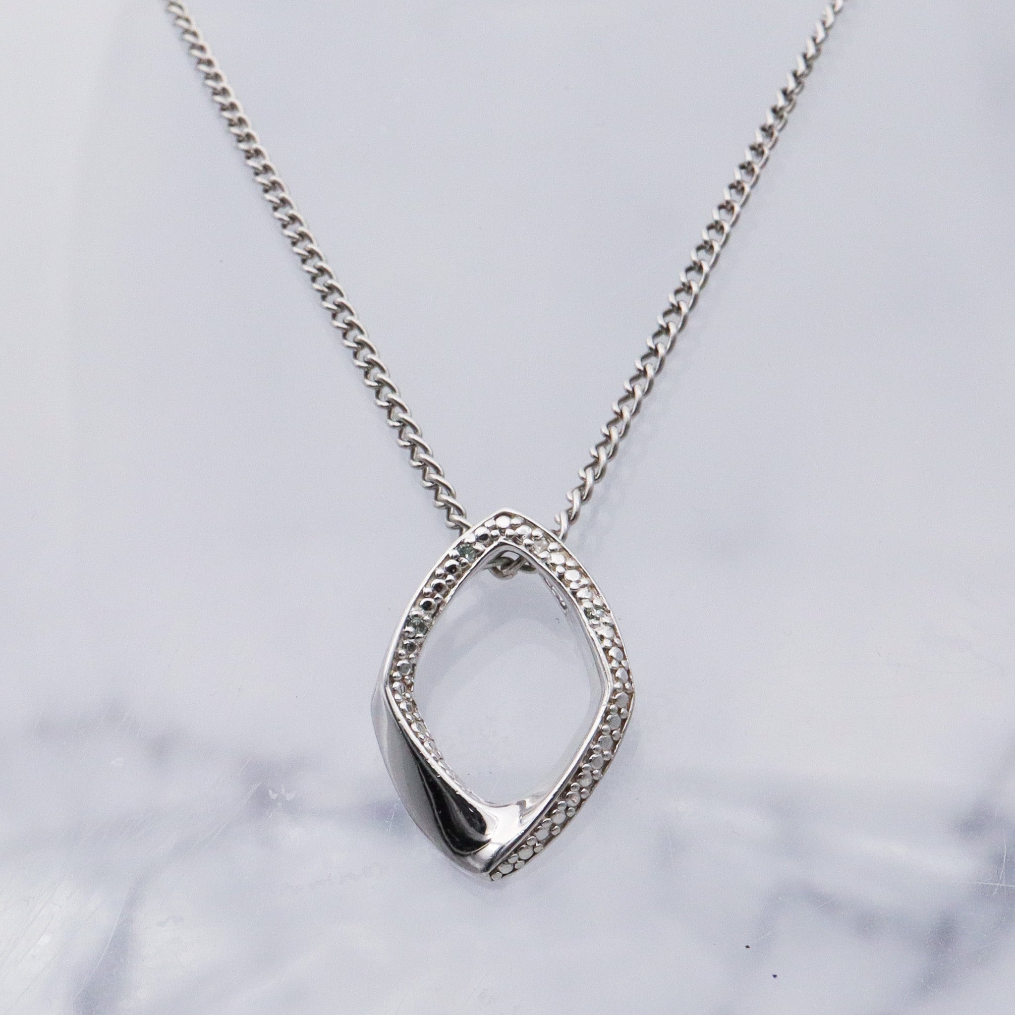 Vintage sterling silver and diamond abstract pendant